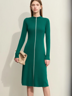 Front view of green long-sleeve knit midi dress with zip-front detail and fitted silhouette