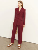 Front view of tailored burgundy pantsuit with double-breasted blazer and straight-leg trousers