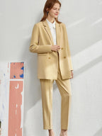 Camel tailored pantsuit with double-breasted blazer and slim trousers, styled with white top