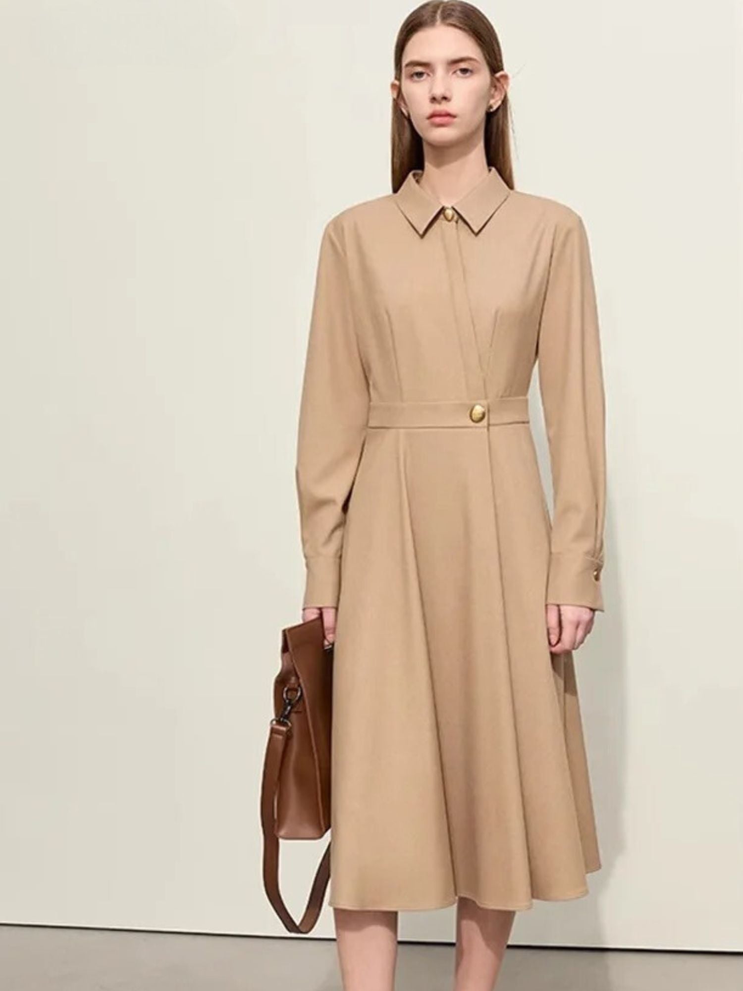 Camel midi dress styled with structured handbag and button-down front detail