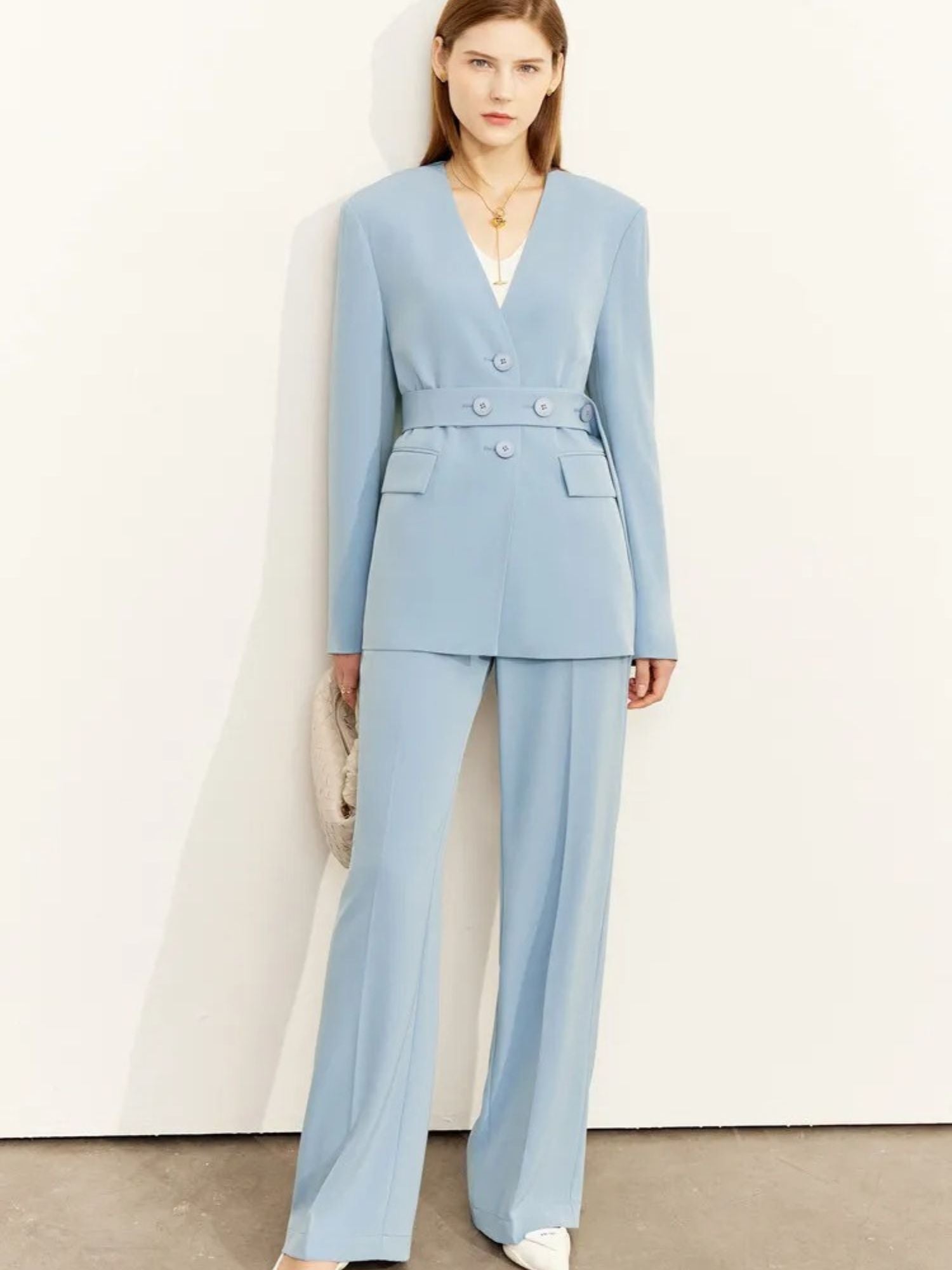 Light blue blazer and wide-leg trousers styled with white blouse and heels