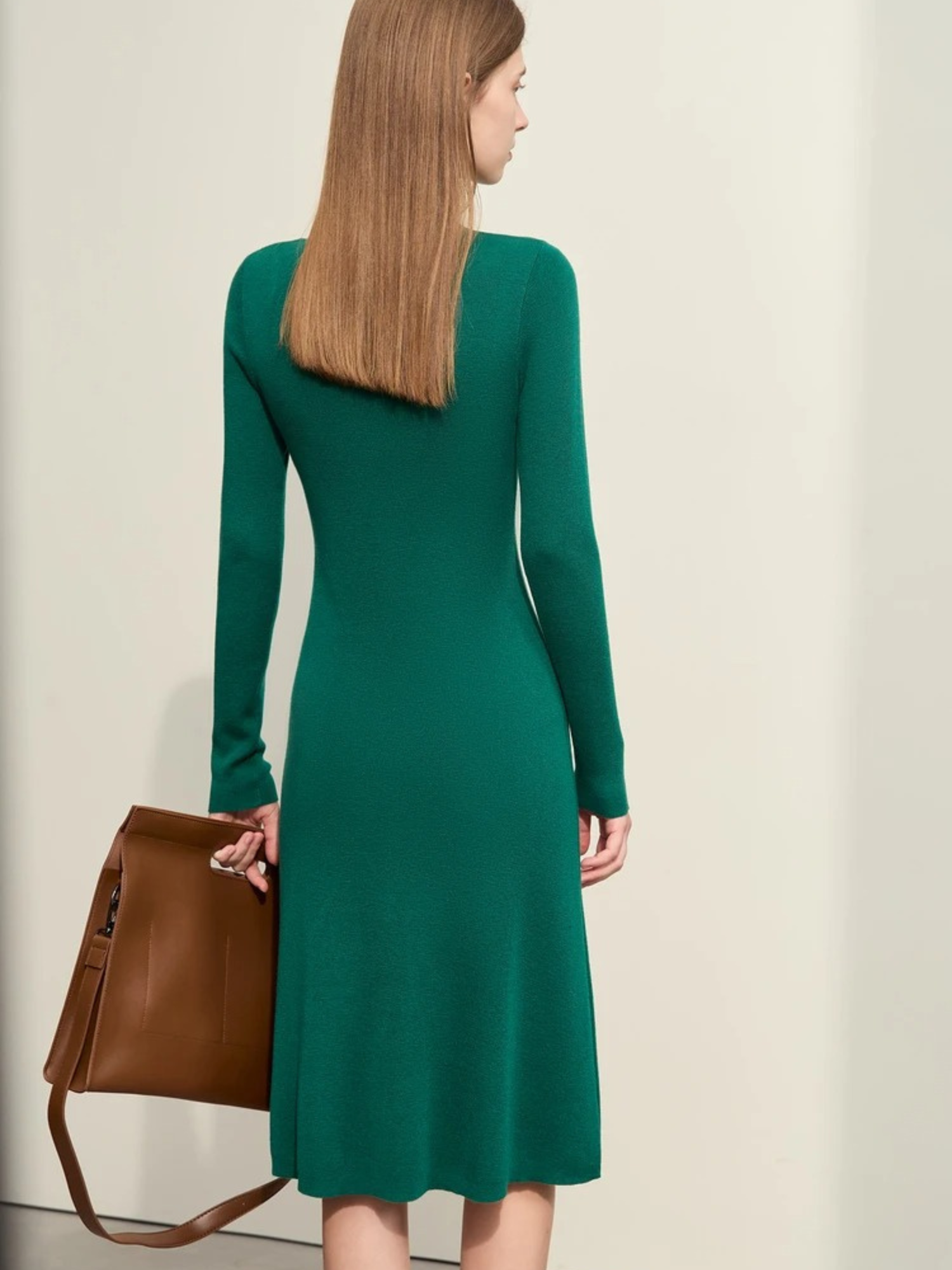 Back view of green bodycon midi dress with zipper and crew neckline