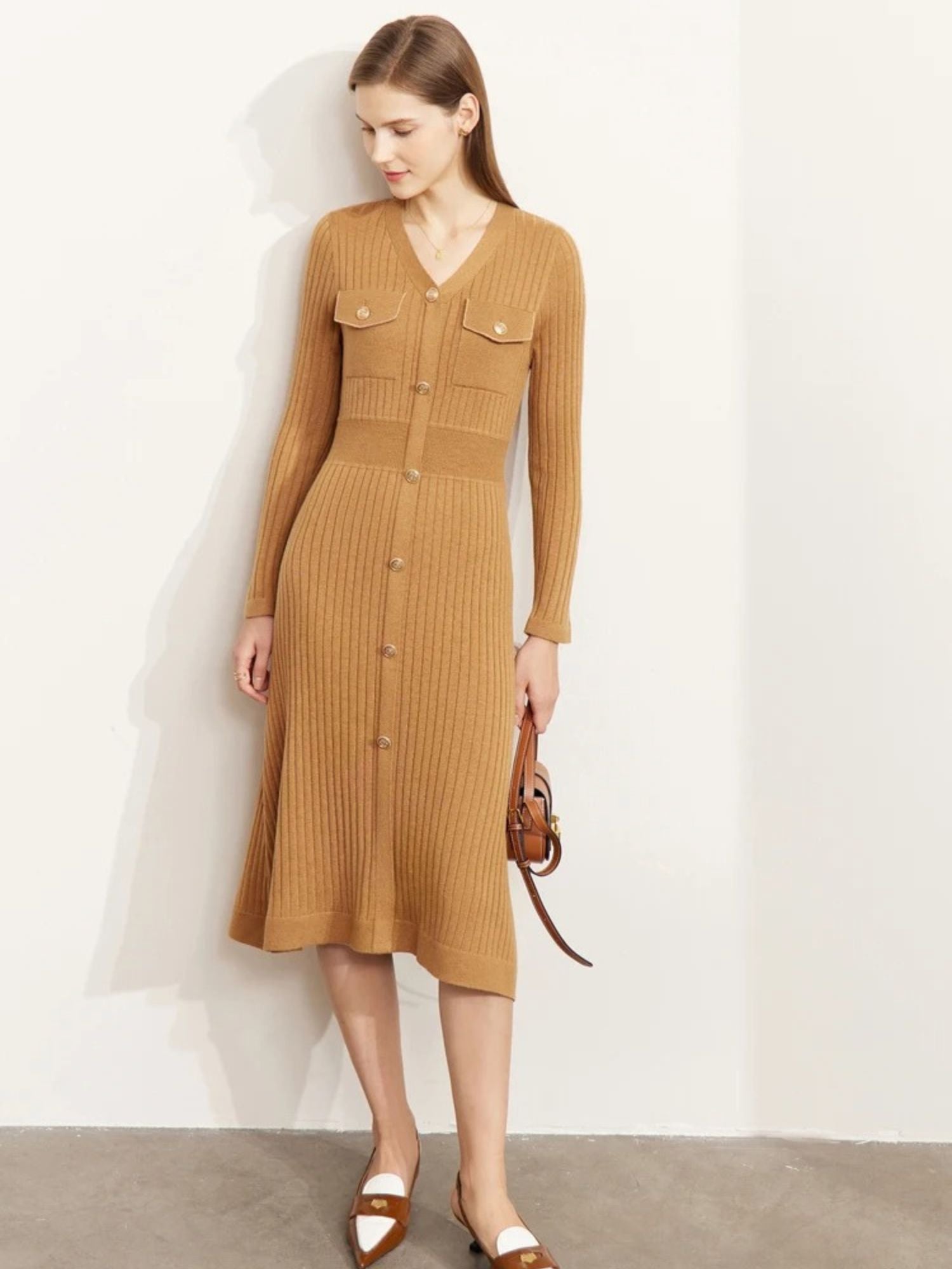 Back view of camel long-sleeve dress with knit texture and v-neckline