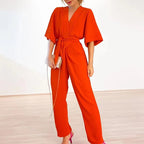 Damen eleganter Jumpsuit mit tiefem V-Ausschnitt und Taillenbindung Sovae