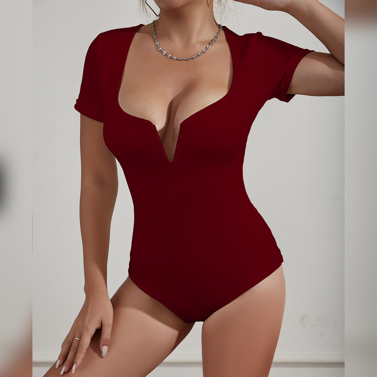 Damen Bodysuit mit tiefem V-Ausschnitt und kurzen Ärmeln Sovae